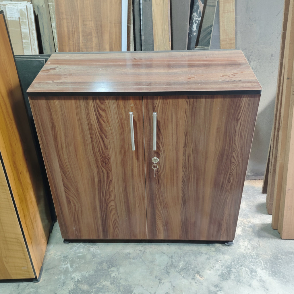 Wooden cabinet with two doors in a showroom setting